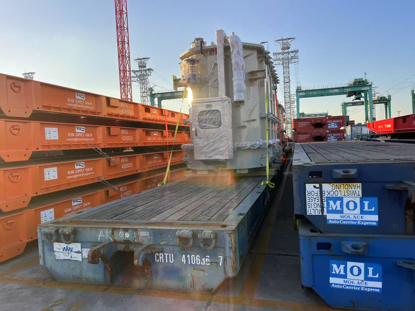 Prime mover truck executing specialized hydraulic trailer transport of an 80+ ton power transformer for inland Africa substation delivery.